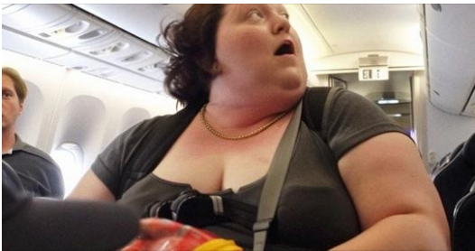 When the captain’s voice is heard speaking to the poor, heavy woman on the plane, the rich man mocks her.