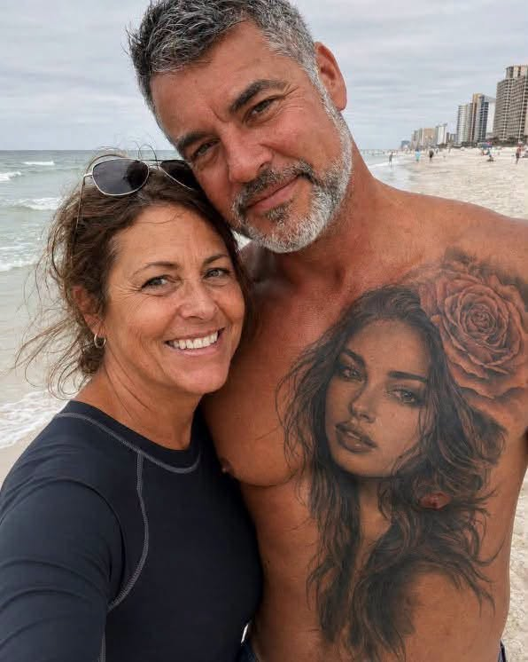My husband had another woman tattooed over his heart FOR 20 YEARS — he swore she was imaginary until I found her. I first noticed the tattoo on our honeymoon. A beautiful young woman stared up from Richard’s chest. She had dark eyes, delicate features, and a tiny rose tucked behind one ear. “Who is she?” I asked. Richard laughed and pulled me closer. “Nobody, Evelyn. Just a face the tattoo artist invented when I was nineteen.” I believed him. For twenty years, I believed him. I believed him through five failed fertility treatments. Through every appointment. Every disappointment. Every month we told ourselves maybe next time would be different. And I still believed him the morning we finally brought home our adopted baby girl, Claire. Over the years, the tattoo became so familiar that eventually I stopped noticing it. Until last month. I was searching through Richard’s toolbox for an insurance document when I noticed one of the wooden panels inside the cabinet was loose. I pulled it back. Something was hidden underneath. A yellowed photograph. The second I saw the woman in it, my entire body went cold. I recognized those eyes immediately. I had been looking at them on my husband’s chest for two decades. And behind her ear was the same tiny rose. Exactly the same. My hands started shaking. Then I noticed what she was holding. A newborn baby. Wrapped in a blanket. Not just any blanket. Claire’s coming-home blanket. The one we had wrapped around our daughter the day we brought her home. I flipped the photograph over. Six words were written across the back in Richard’s handwriting. “Forgive me, Rose. She can’t know.” My knees hit the garage floor. For several minutes, I just sat there. Who was Rose? Why had Richard lied about her for twenty years? And why was she holding our daughter? I searched through everything hidden behind that panel. Old receipts. Business cards. A small address book. Near the back, I found one name. Rose. And beside it, an old phone number. I called before I could talk myself out of it. The phone rang four times. Then an older woman answered. “Hello?” My throat tightened. “Is this Rose?” Silence. Then she whispered: “Richard?” My stomach twisted. “Is that really you?” I gripped the phone harder. “This isn’t Richard.” Another long pause. “It’s his wife.” I heard her inhale sharply. Then she started crying. Deep, broken sobs. And finally she said: “YOU FINALLY FOUND ME.” I couldn’t breathe. “I thought this day would never come.” “Who are you?” She didn’t answer. “Why do I have a picture of you holding Claire?” Nothing. “What did Richard do?” Rose cried harder. Then she said: “I can’t tell you over the phone.” She gave me the address of a diner in the next town. “Come alone.” I didn’t wait for Richard to get home from work. My hands shook so badly while I was driving that I missed the turn twice. When I finally reached the diner, Rose was already sitting in the last booth near the window. Silver hair. Trembling fingers wrapped around a coffee cup. But even after all those years, I recognized her immediately. She was the woman tattooed over my husband’s heart. I slid into the booth across from her. “You’re Evelyn,” she said quietly. “And you’re the woman on my husband’s chest.” Her face crumpled. I placed the photograph on the table between us. “Start talking.” Rose stared down at it. Then at me. Before she could answer, the bell above the diner door rang. Her eyes suddenly moved past my shoulder. All the color drained from her face. I turned around. Someone was walking directly toward our booth. And when I saw WHO it was, I nearly fainted. Because I recognized that face too. And suddenly, the photograph of Claire in Rose’s arms wasn’t the biggest secret Richard had been hiding from me. Type KEYS and I’ll continue. (I know you’re curious about the next part, so please be patient and read on in the comments below. Thank you for your understanding of the inconvenience. please leave a ‘KEYS’ comment below and give us a “Like ” to get full story )???? See less