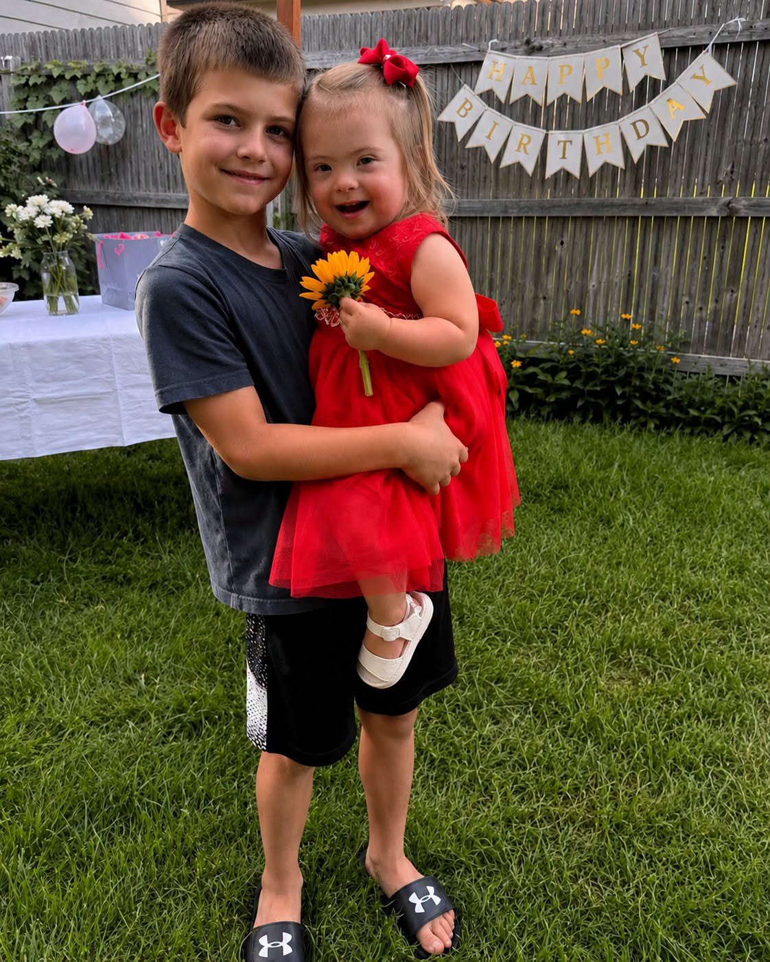 My 8-Year-Old Son Gave Away His Lunch Money to Buy a Little Girl with Down Syndrome a Red Dress — By Morning, Someone Had Left Dozens of Lunchboxes on Our Lawn… What Was Hidden Inside the Biggest One Left My Son Frozen